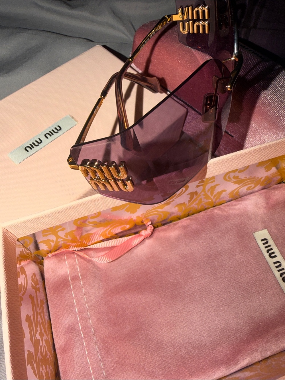 Miu Miu Purple Rimless Shield Sunglasses with Gold Logo Accent